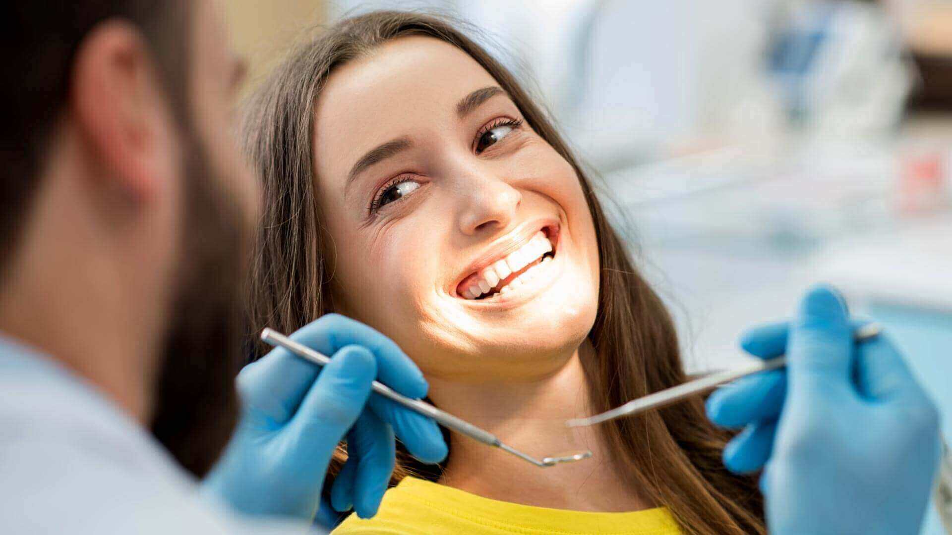 The patient smile with dentist